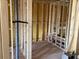 Bathroom under construction featuring wood framing, plumbing for a tub, and electrical wiring, ready for customization at 15465 Hamlin Park Drive, Winter Garden, FL 34787