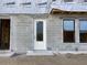 Townhome entrance under construction featuring block foundation and a framed doorway with weather resistant covering at 15465 Hamlin Park Drive, Winter Garden, FL 34787