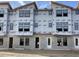 Townhome construction showcasing windows and block foundation protected with Typar weather-resistant wrap at 15465 Hamlin Park Drive, Winter Garden, FL 34787