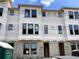 Townhome under construction featuring multiple windows, block foundation, and Typar-branded moisture wrap at 15465 Hamlin Park Drive, Winter Garden, FL 34787
