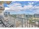 Balcony with seating overlooking the city skyline and beautiful blue sky with clouds at 155 S Court Ave # 1909, Orlando, FL 32801