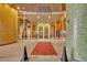 Modern condominium building entrance with glass doors and mosaic columns at 155 S Court Ave # 1909, Orlando, FL 32801