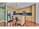 Modern kitchen featuring stainless steel appliances, granite countertops, an island and ample cabinet space at 155 S Court Ave # 1909, Orlando, FL 32801