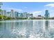 Serene lake view featuring a fountain and the city skyline in the background at 155 S Court Ave # 1909, Orlando, FL 32801
