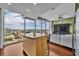 Living room featuring a kitchen island and floor-to-ceiling windows with city views at 155 S Court Ave # 1909, Orlando, FL 32801