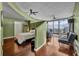 Modern main bedroom with wood floors, city views, and seating area at 155 S Court Ave # 1909, Orlando, FL 32801
