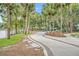 Scenic walking path through the community, lined with palm trees and lush landscaping near the lake at 155 S Court Ave # 1909, Orlando, FL 32801