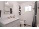 Bright bathroom boasts a marble vanity, updated fixtures, and ample natural light at 1748 Harvest Cv, Winter Park, FL 32792