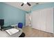 Another view of bedroom with large closet, ceiling fan, and computer desk at 1748 Harvest Cv, Winter Park, FL 32792