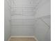 Walk-in closet featuring shelving and new flooring at 1748 Harvest Cv, Winter Park, FL 32792