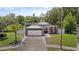 Well-maintained single Gathering home with brick accents, a 2-car garage, and a neatly manicured lawn at 1748 Harvest Cv, Winter Park, FL 32792