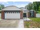 Charming single-Gathering home with a brick facade, attached garage and landscaped front yard at 1748 Harvest Cv, Winter Park, FL 32792