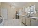 Bright kitchen with white cabinetry, stainless steel appliances, and ample counter space at 1748 Harvest Cv, Winter Park, FL 32792