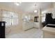 Clean kitchen with white cabinets, tile floors and backsplash, and updated appliances at 1748 Harvest Cv, Winter Park, FL 32792