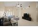 Comfortable living room with vaulted ceilings, neutral tones, and tile flooring at 1748 Harvest Cv, Winter Park, FL 32792