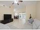 Spacious living room with tile floors, a large window, and dining area at 1748 Harvest Cv, Winter Park, FL 32792