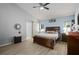 Spacious main bedroom featuring vaulted ceiling, fan, barn door, and plenty of natural light at 1748 Harvest Cv, Winter Park, FL 32792