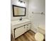 Updated bathroom with modern vanity, barn door and sleek design at 1825 Foxhall Cir # 1825, Kissimmee, FL 34741