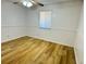 Comfortable bedroom with wood floors and a ceiling fan at 1825 Foxhall Cir # 1825, Kissimmee, FL 34741