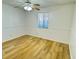Inviting bedroom with wood floors, featuring a ceiling fan and natural light at 1825 Foxhall Cir # 1825, Kissimmee, FL 34741