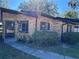 Charming brick home with black trim, and a well-maintained front yard at 1825 Foxhall Cir # 1825, Kissimmee, FL 34741