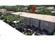This aerial view shows the townhome community, landscaping and fenced backyard patios at 200 Saint Andrews Blvd # 3002, Winter Park, FL 32792