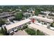 This aerial view shows the townhome community, landscaping, parking and nearby road at 200 Saint Andrews Blvd # 3002, Winter Park, FL 32792
