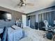 Unique bedroom with soundproofing wall texture, ceiling fan, carpeting, closet and home office at 200 Saint Andrews Blvd # 3002, Winter Park, FL 32792