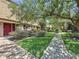 Charming townhouse complex with lush green lawns and mature trees creating a serene atmosphere at 200 Saint Andrews Blvd # 3002, Winter Park, FL 32792
