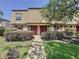 Inviting townhouse with a brick facade, red door and shutters, and well-maintained landscaping at 200 Saint Andrews Blvd # 3002, Winter Park, FL 32792