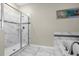 Modern bathroom with a tiled shower, separate tub, and white-and-grey marble flooring at 2927 Fable St, Kissimmee, FL 34746