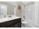 Bathroom featuring a single sink vanity, mirror, toilet, and shower with a curtain at 2927 Fable St, Kissimmee, FL 34746