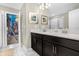 Bathroom with double sinks and view into themed bedroom at 2927 Fable St, Kissimmee, FL 34746