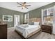 Inviting bedroom featuring a plush bed, accent wall, and well-lit windows, providing a cozy retreat at 2927 Fable St, Kissimmee, FL 34746