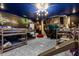 Themed bedroom with custom artwork, a chandelier, bunk beds, and a slide at 2927 Fable St, Kissimmee, FL 34746