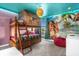 Fun bunk bedroom features a custom-made tiki hut bunk bed and colorful ocean mural at 2927 Fable St, Kissimmee, FL 34746