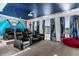 Home theater with reclining chairs, a large mural, and Star Wars-themed decor at 2927 Fable St, Kissimmee, FL 34746