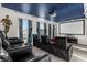Home theater features multiple black leather recliners and a projector at 2927 Fable St, Kissimmee, FL 34746