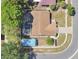 A birds eye view showing a pool, patio, carport, driveway, yard and surrounding homes at 3217 Castle Oak Ave, Orlando, FL 32808