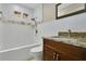 Bathroom with tiled shower and granite vanity top at 3217 Castle Oak Ave, Orlando, FL 32808