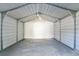 Spacious interior of a metal carport, offering ample room for parking and/or storage of personal items at 3217 Castle Oak Ave, Orlando, FL 32808