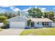 Charming single-story home featuring a well-maintained lawn, two-car garage, and a beautifully painted exterior at 3217 Castle Oak Ave, Orlando, FL 32808