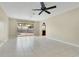 Bright and spacious living room featuring neutral tile floors and sliding glass doors leading to outdoor pool area at 3217 Castle Oak Ave, Orlando, FL 32808