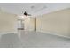 Open living space with neutral walls, tile flooring, and a view of the front entrance at 3217 Castle Oak Ave, Orlando, FL 32808
