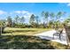 A fenced community dog park with seating, providing a secure and enjoyable space for residents and their pets at 3334 Arch Ave, Ormond Beach, FL 32174