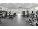 Bright fitness center with a variety of exercise machines and free weights at 3334 Arch Ave, Ormond Beach, FL 32174