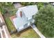 The house has a wooden patio and a brick chimney that is surrounded by a well-manicured lawn at 338 E Anderson St, Orlando, FL 32801