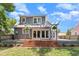 The house has a wooden patio with a pergola and a well-manicured lawn for relaxing outdoors at 338 E Anderson St, Orlando, FL 32801