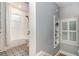 This bathroom features subway tile, a shower/tub combo, unique tile floors, and a built-in shelf at 338 E Anderson St, Orlando, FL 32801