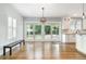 Bright dining area with hardwood floors, chandelier, and seamless access to the modern kitchen at 338 E Anderson St, Orlando, FL 32801